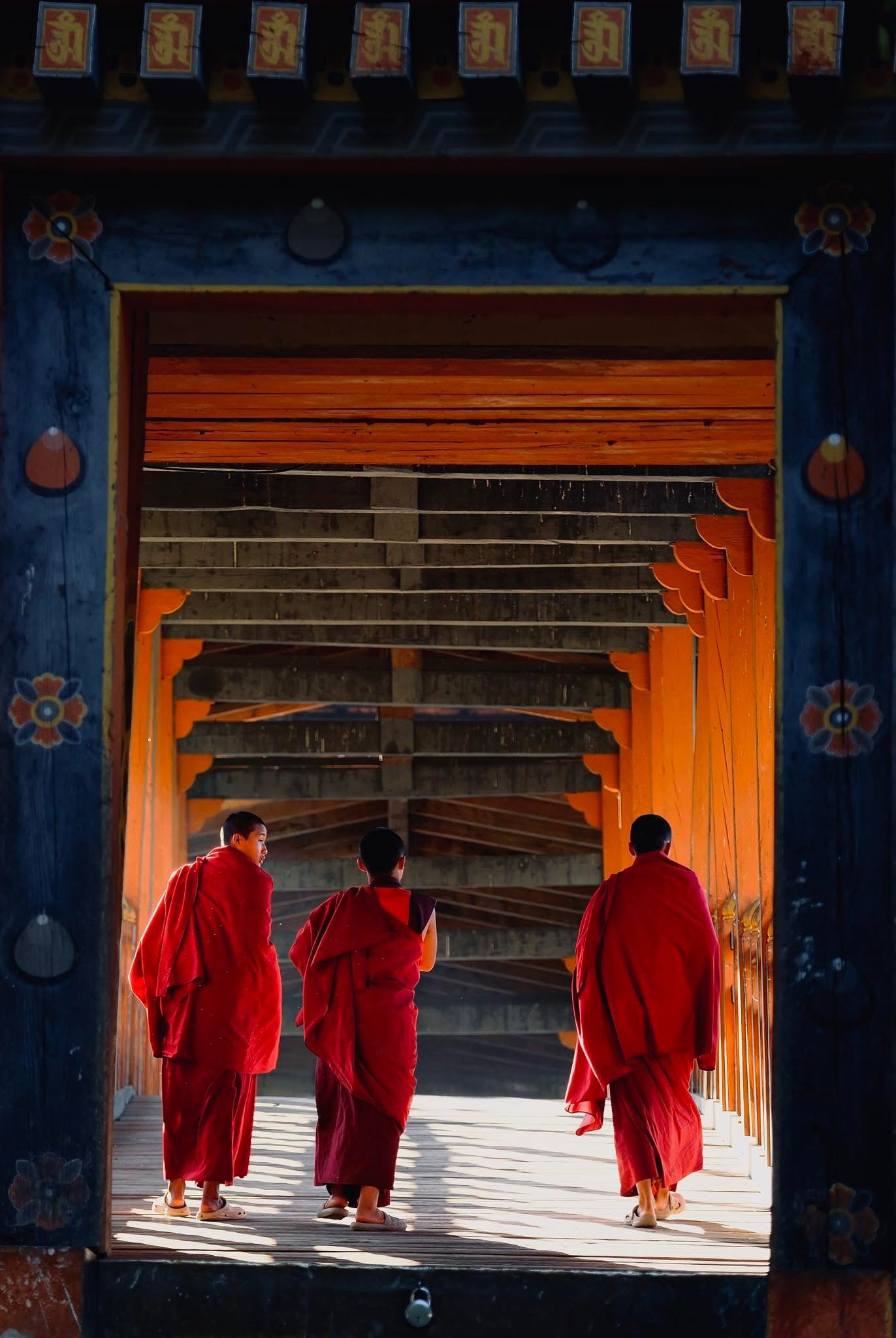Monks in monastery corridor